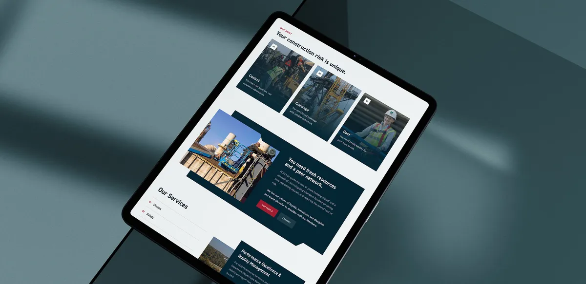 A photo of an ipad with the ACIG website on it